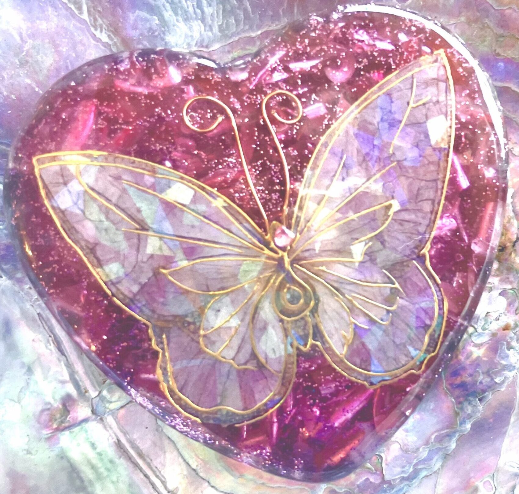 Beautiful Powerful Exquisite Orgonite Orgone Hearts are meticulously handcrafted with Hawaiian botanicals, Double-terminated crystals and lovely gemstones: Amethyst, Rose Quartz, Lapis Lazuli, Peridot, Aquamarine, Malachite and Howlite. Dr. Wilhelm Reich 50/50 ratio of resin to metal making it powerful orgonite. Orgonite transmutes the electromagnetic vibrations of modern technology into a frequency compatible with human well-being. Orgonite assists in balancing all of our bodies and fields to bring us into natural states of harmony and re-establishing energy flow in our body meridian system. Orgone, Orgonite for children, kids, gifts, Valentine's day, mother's day, father's day, birthdays, holidays, baby gifts, pets, all occasion. Orgonite devices transform the environment into a life-affirming atmosphere. transmutes EMR and ELF radiation from microwaves, Smart meters, computers, hand-held devices, Wi-Fi, Bluetooth, etc. Orgonite works perpetually & functions as a self-generating transmutation device. It never expires! Orgonite Orgone jewelry, necklaces, amulets. Meditation. Orgonites Orgone Orgonite cell phone shields. Orgone Orgonite Orgone Tablet shields. Orgonite Orgone monitor shields. Orgonite Orgone meditation. wifi protection Orgonite Orgone. Orgonite Orgone for sleep, healing, relaxation. Orgonite Orgone microwave shields. Orgonite Orgone appliance shields.