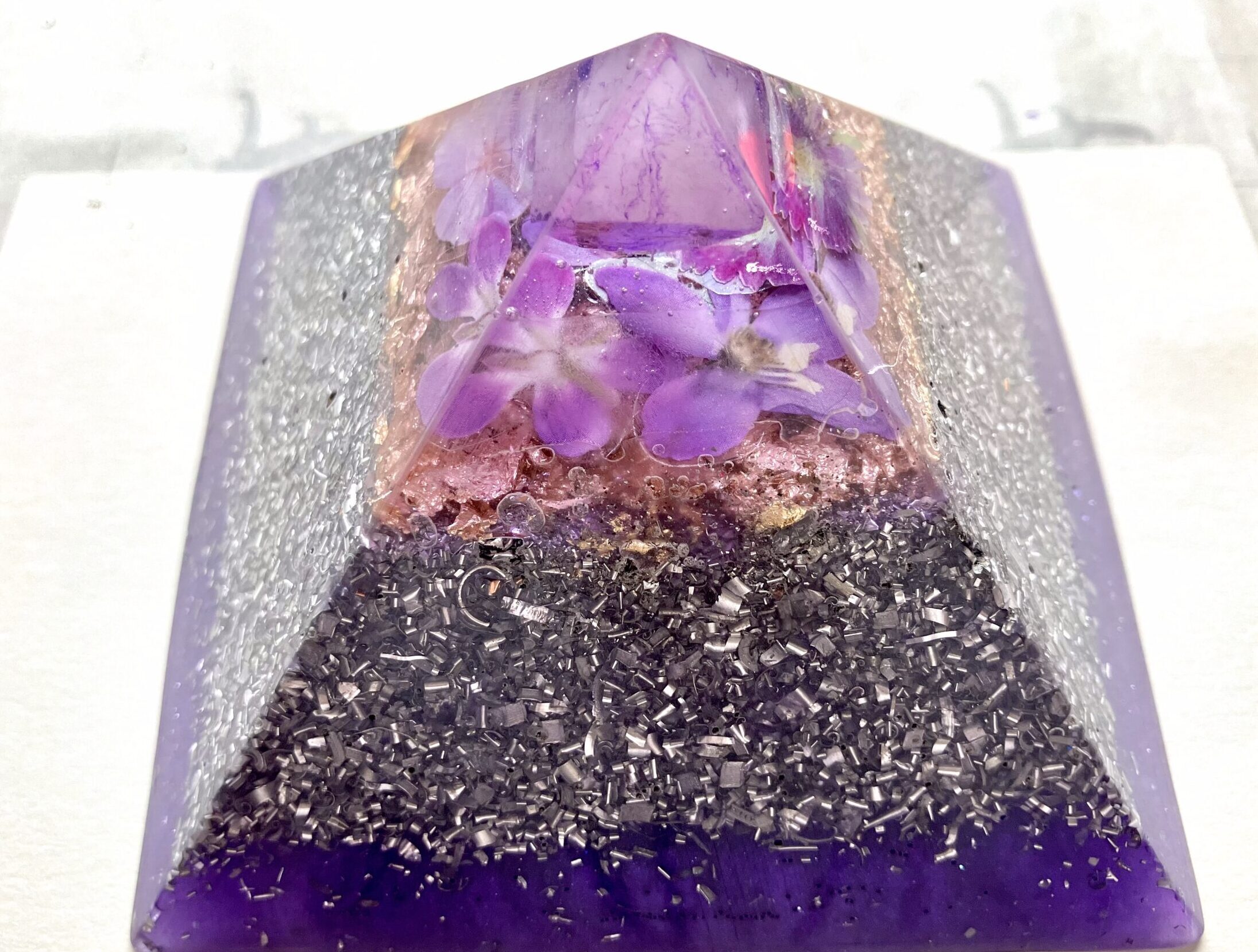 Beautiful Powerful Exquisite Fairy Orgonite Orgone Hearts Pyramids are meticulously handcrafted with Hawaiian botanicals, Double-terminated crystals and lovely gemstones: Amethyst, Rose Quartz, Lapis Lazuli, Peridot, Aquamarine, Malachite and Howlite. Dr. Wilhelm Reich 50/50 ratio of resin to metal making it powerful orgonite. Orgonite transmutes the electromagnetic vibrations of modern technology into a frequency compatible with human well-being. Orgonite assists in balancing all of our bodies and fields to bring us into natural states of harmony and re-establishing energy flow in our body meridian system. Orgone, Orgonite for children, kids, gifts, Valentine's day, mother's day, father's day, birthdays, holidays, baby gifts, pets, all occasion. Orgonite devices transform the environment into a life-affirming atmosphere. transmutes EMR and ELF radiation from microwaves, Smart meters, computers, hand-held devices, Wi-Fi, Bluetooth, etc. Orgonite works perpetually & functions as a self-generating transmutation device. It never expires! Orgonite Orgone Orgonites Orgone Orgonite Orgone Orgonite Orgone Orgonite Orgone Orgonite Orgone Orgonite Orgone Orgonite Orgone